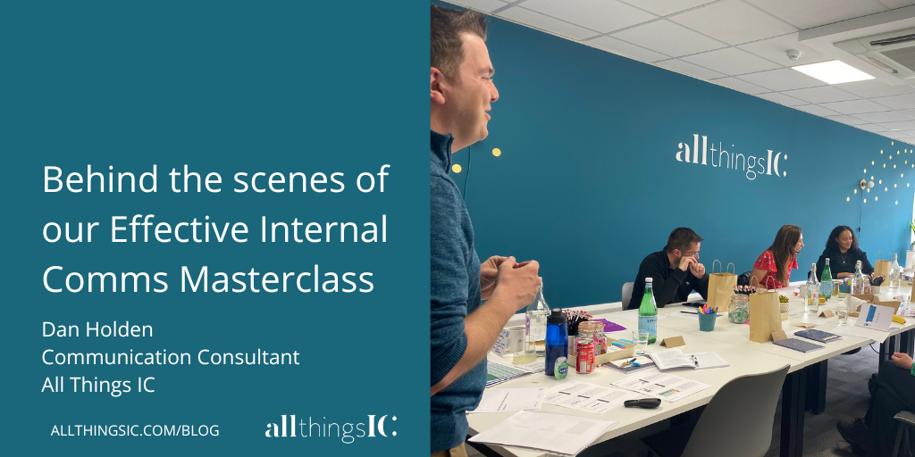 Photo of Dan Holden stood teaching a group of communicators at the All Things IC Hub